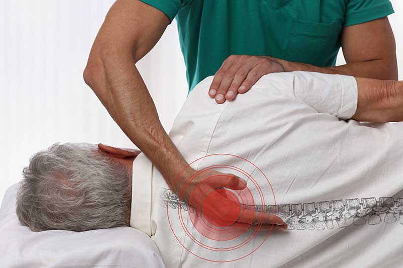 chiropractor with hands on back pain chiropractor with hands on back pain
