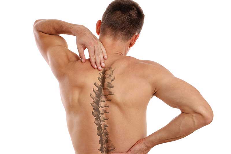 man with back muscle pain